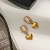 Gold Oval Hoop Earrings with Puffed Heart Charms