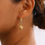 Gold Oval Hoop Earrings with Puffed Heart Charms